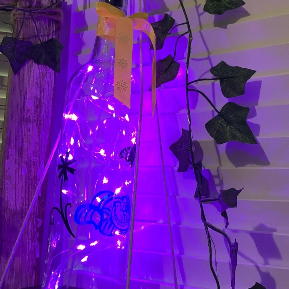 Iridescent Cheshire Cat wine bottle lantern